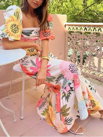 Maxi dress with square neckline, floral pattern, and puff sleeves
